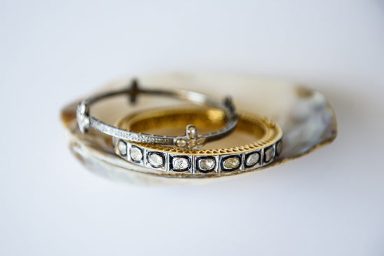 pave diamond cuff in gold/silver and silver bangle with gold flower accents 