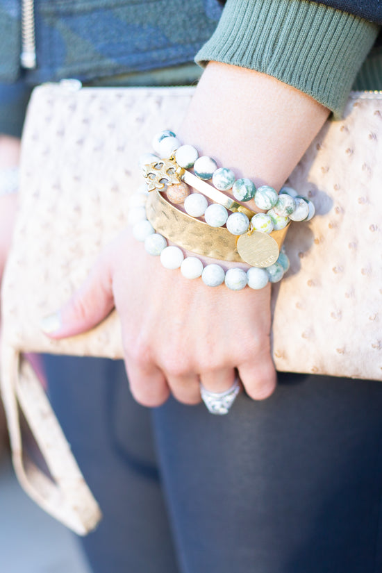 stacked bead and brass bracelets 