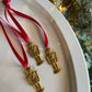 Vintage Nutcracker Ornament | Stamped Brass